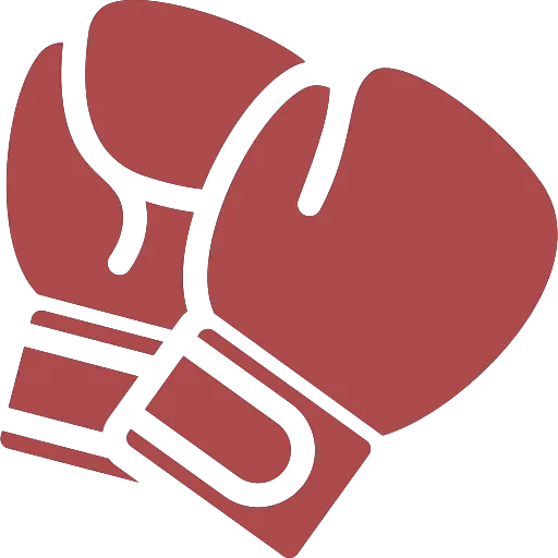 A pair of red boxing gloves sitting on top of each other.